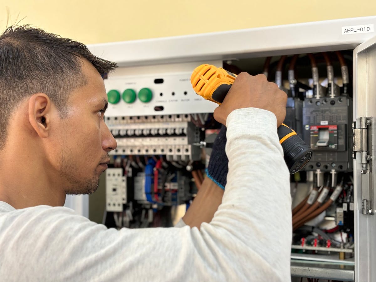 Electrician at work on a residential panel